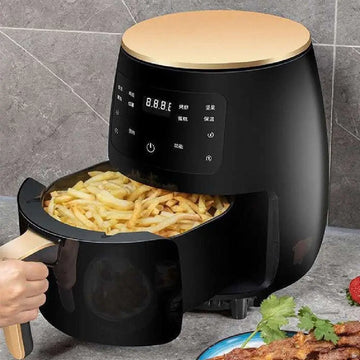 Black air fryer with gold lid and handle, digital control panel with Chinese characters for best home kitchen upgrade.