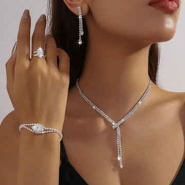 Sparkling silver diamond necklace with v-shaped design and teardrop pendant from RoyalEssenceLux bridal jewelry sets