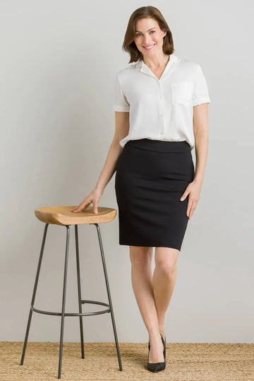 Black pencil skirt with fitted silhouette and subtle waistband detail from RoyalEssenceLux luxury women’s fashion skirts collection