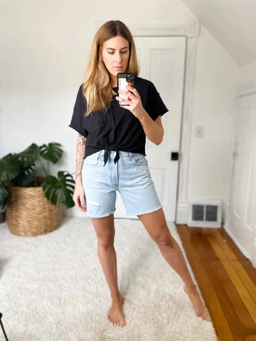 Black short-sleeved tied-front top from RoyalEssenceLux trendy women’s shorts collection in luxury women’s fashion
