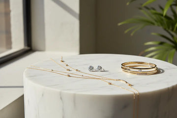 Gold-toned diamond-studded bangle set with a delicate stacked design from royalessencelux featuring quality materials.