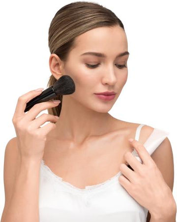 Black makeup brush with rounded dense bristle head and sleek handle from royalessencelux trendy fashion beauty collection