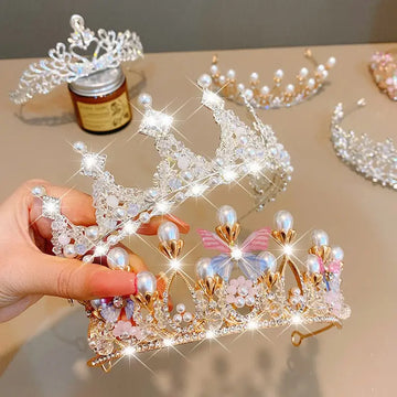 A delicate gold and crystal wedding hair jewelry tiara with pearls rhinestones and pink floral embellishments from RoyalEssenceLux.