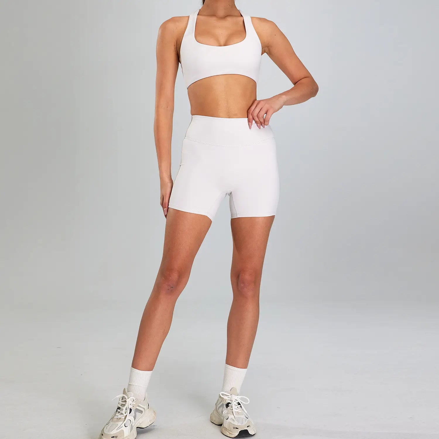 white seamless athletic two-piece set featuring a crop top and high-waisted shorts designed for outdoor running nude and sports suit outdoor use