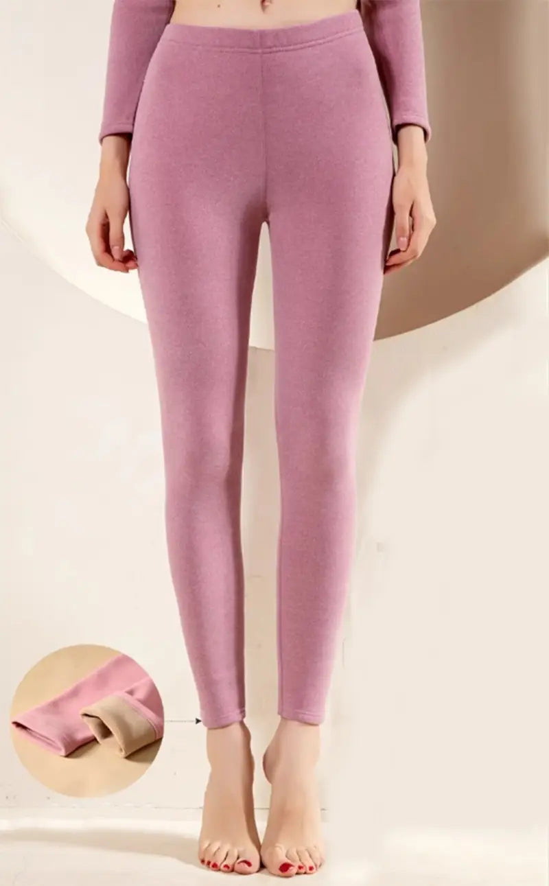 a pair of women’s warm cashmere fleece lined thermal leggings in soft lavender with a snug fit and ribbed cuffs ideal for warm cashmere winter wear