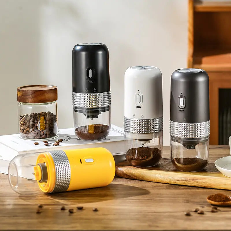yellow cylindrical portable electric ceramic coffee grinder with metallic textured band and transparent body usb charging