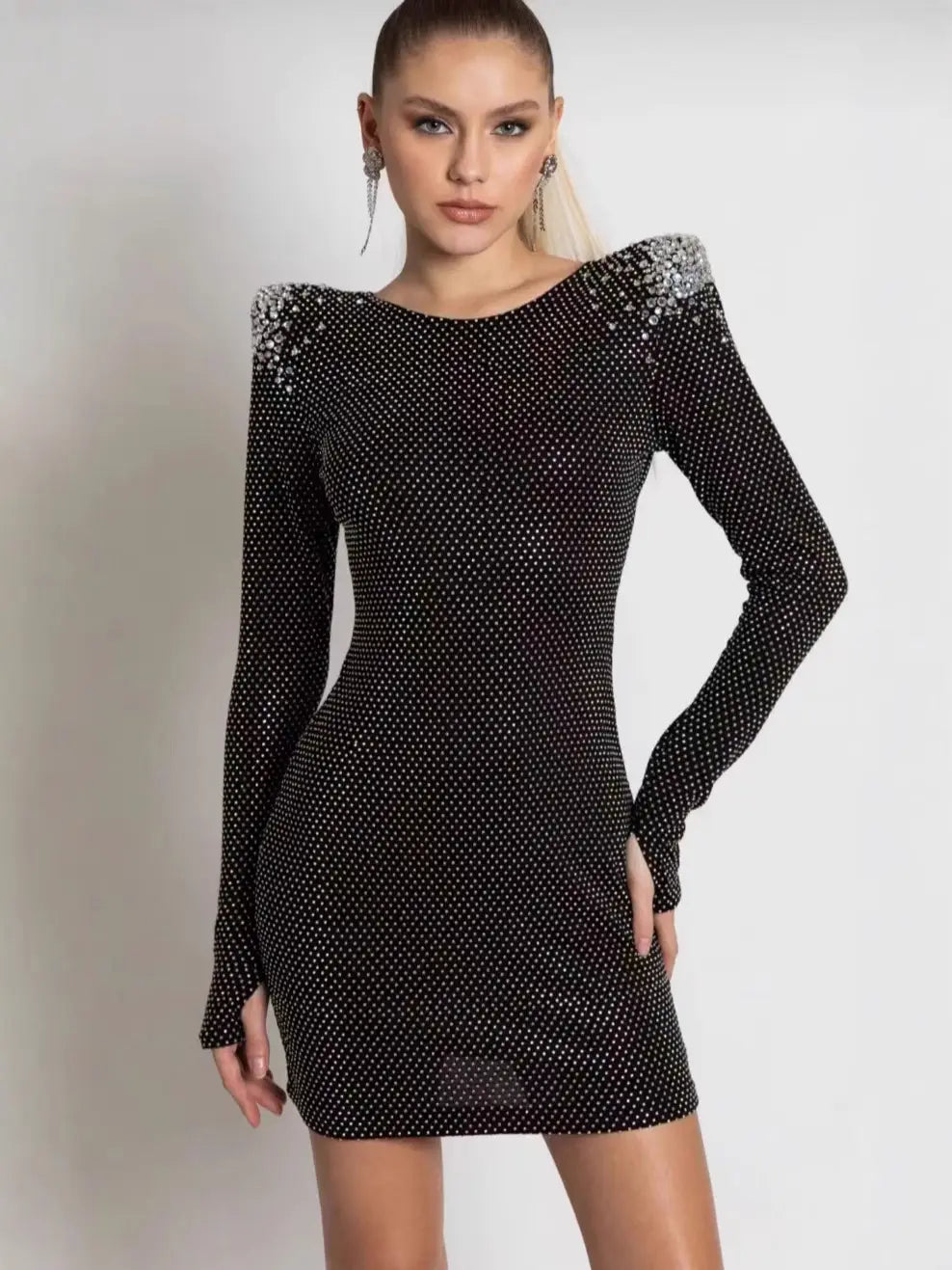 Black long-sleeved mini dress featuring sparkling silver rhinestones along the shoulders and fabric designed as a sexy rhinestone bandage dress suitable for cross border foreign shoppers.