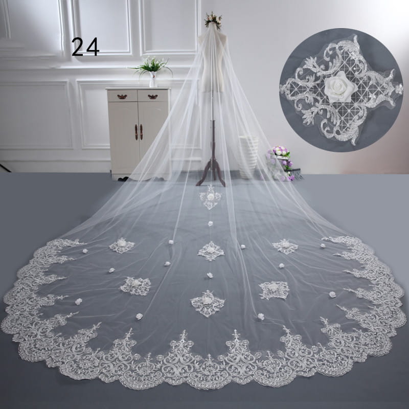 Long lace wedding veil meters wide style featuring a flowing white lace fabric with intricate floral embroidery and beaded accents along the hem.