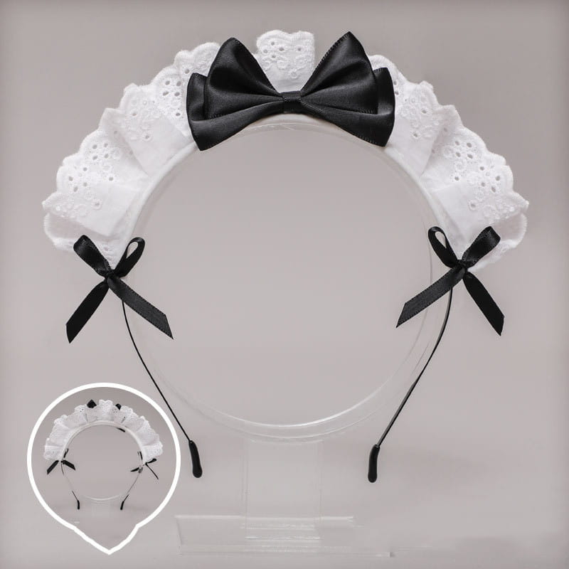 White lace bow maid headband featuring a black satin central bow and smaller black bows on each side with red accents.
