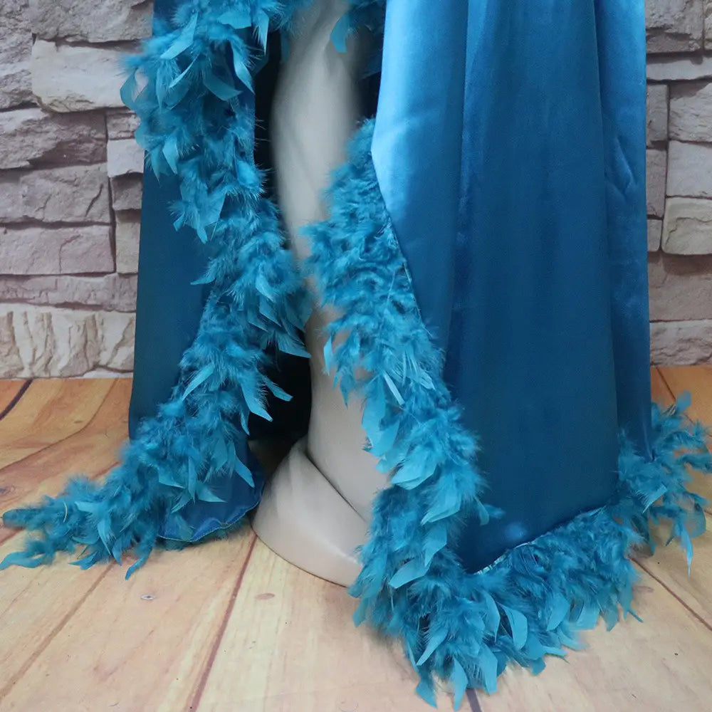 a vibrant turquoise feather boa with plush layered texture and soft feathery fringe designed for a loose dress luxury fully surrounded by elegance in the orange feathered loose dress luxury robe