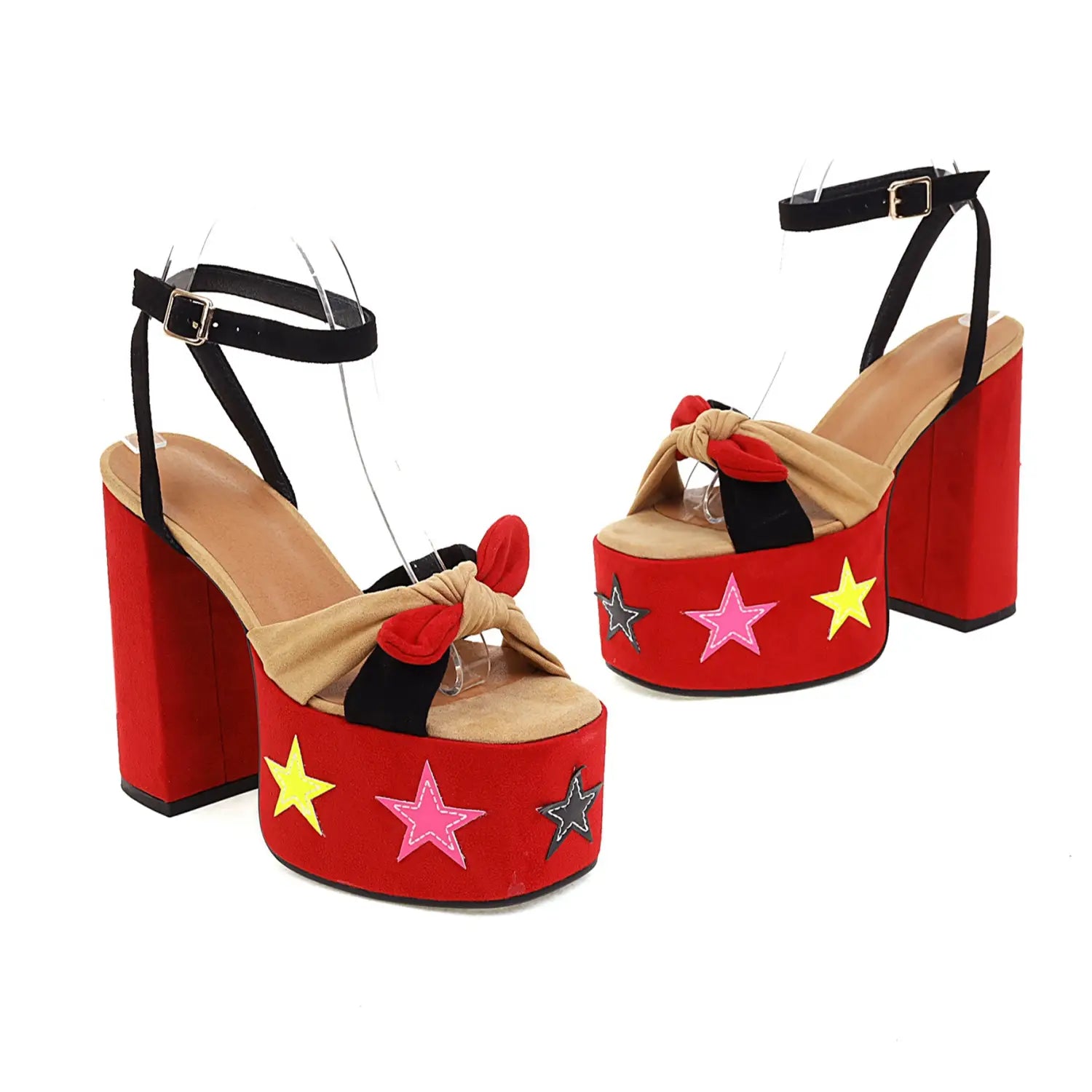 Red star appliqué chunky high heel platform sandals in red featuring a tan and black bow detail with colorful pink yellow and silver star appliqués on the sides.