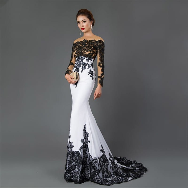 Elegant off-the-shoulder white embroidered lace maxi fishtail slim tail gown with black lace detailing on the bodice sleeves and hem.