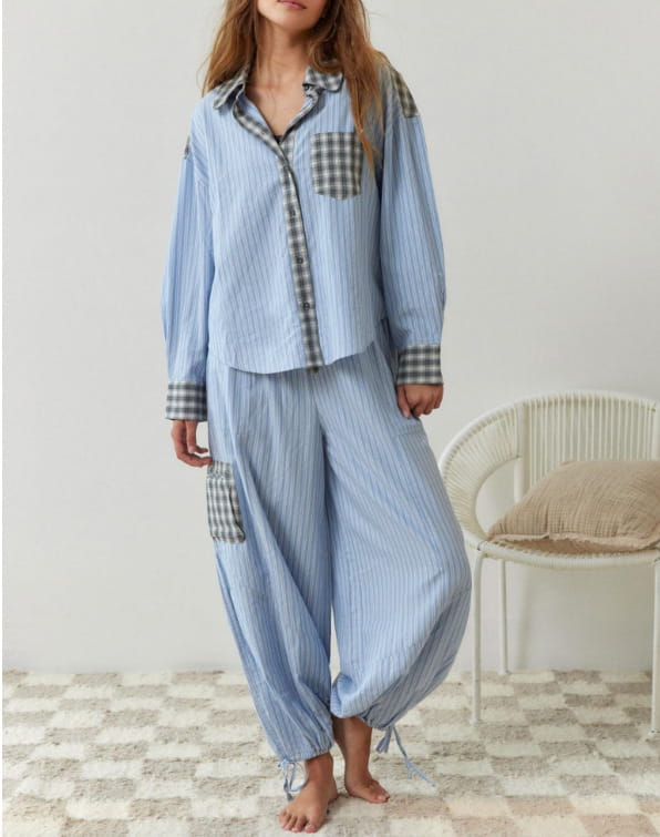 women’s pink muted plaid shirt dressing gown paired with a light blue vertically striped pajama set featuring contrasting gray and white gingham patches on the chest pocket cuffs and side pockets in a plaid shirt outfit