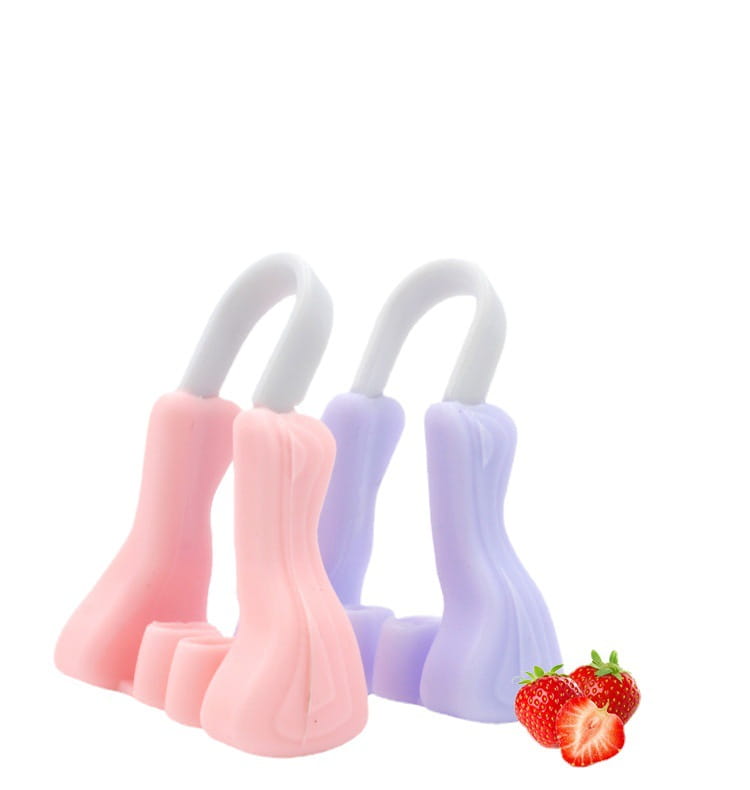 pink and lavender silicone nose reshaping clips with white plastic handles designed as silicone nose reshaping clips for nose reshaping purposes