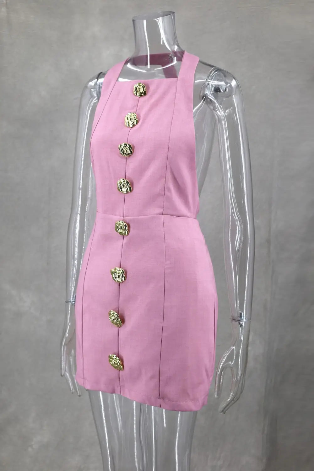 Pink sleeveless dress with ornate gold toned rose button design down the front