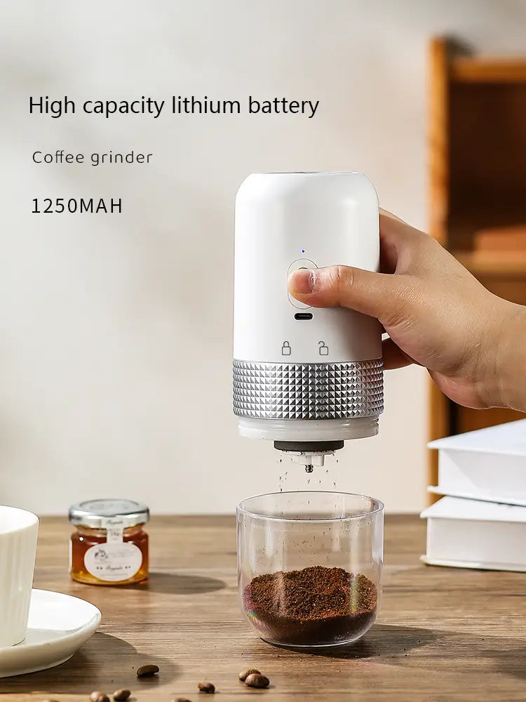 White and silver portable electric ceramic coffee grinder with a textured metallic band and USB charging capability