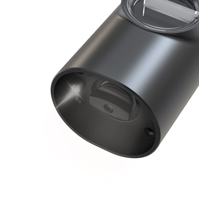 Black cylindrical electric kitchen household grinder with a matte finish and transparent circular lid for efficient kitchen household grinding tasks.