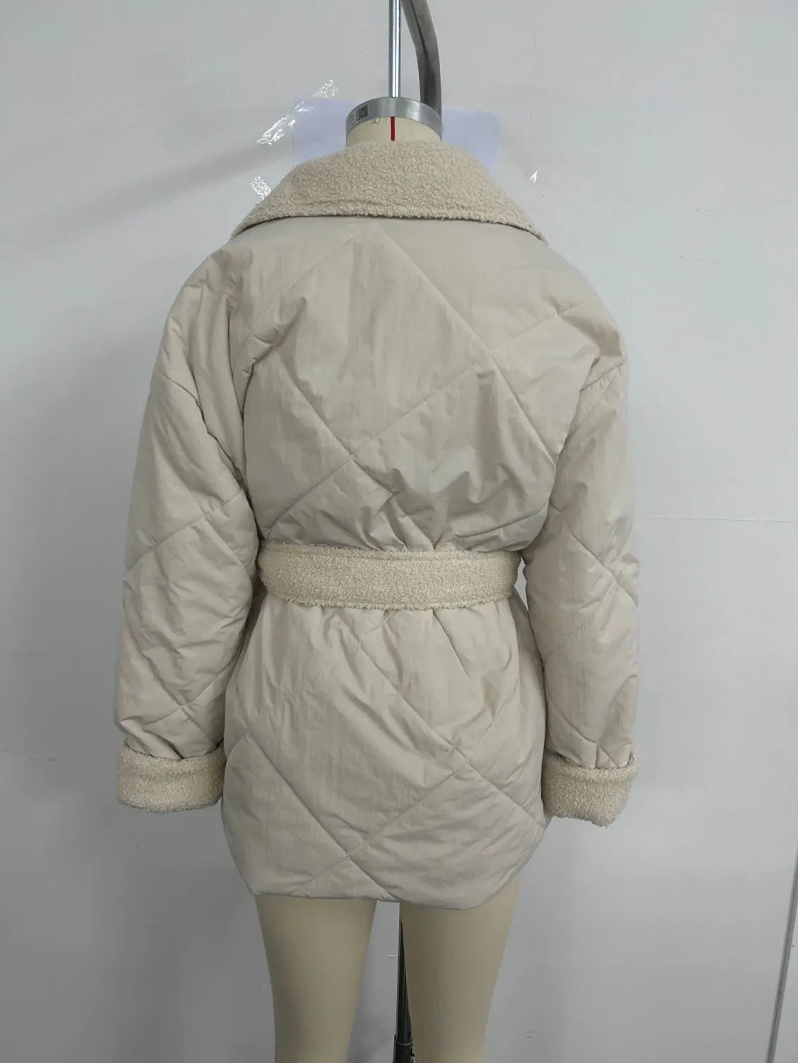 beige winter lapel plaid coat featuring a quilted design with plush shearling-lined collar and cuffs for stylish plaid coat fashion.