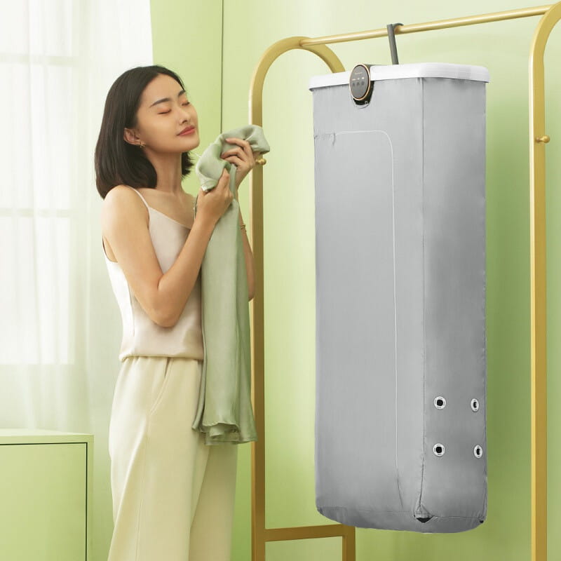 gray fabric garment dryer with digital control panel and four circular ventilation holes designed as a foldable clothes household small quick dryer