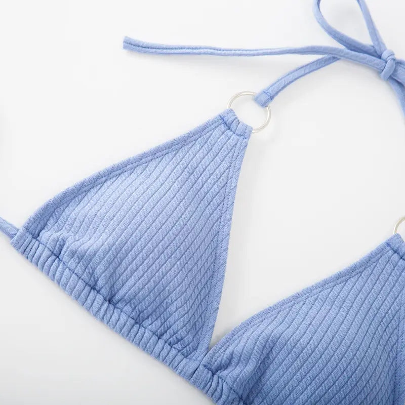 Light blue ribbed triangle bikini top with adjustable straps and silver metal rings from a white ribbed sexy bikini set with gold ring accents ideal for bikini set summer and tie thong bandage styles.