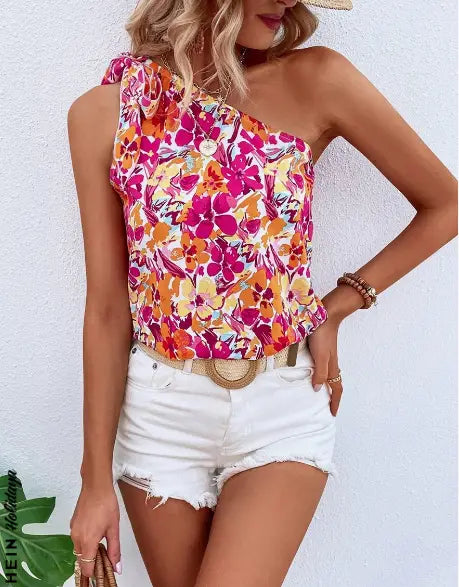 Vibrant holidaya allover floral print knot one shoulder blouse in pink orange and yellow hues made of lightweight fabric for a stylish summer look.