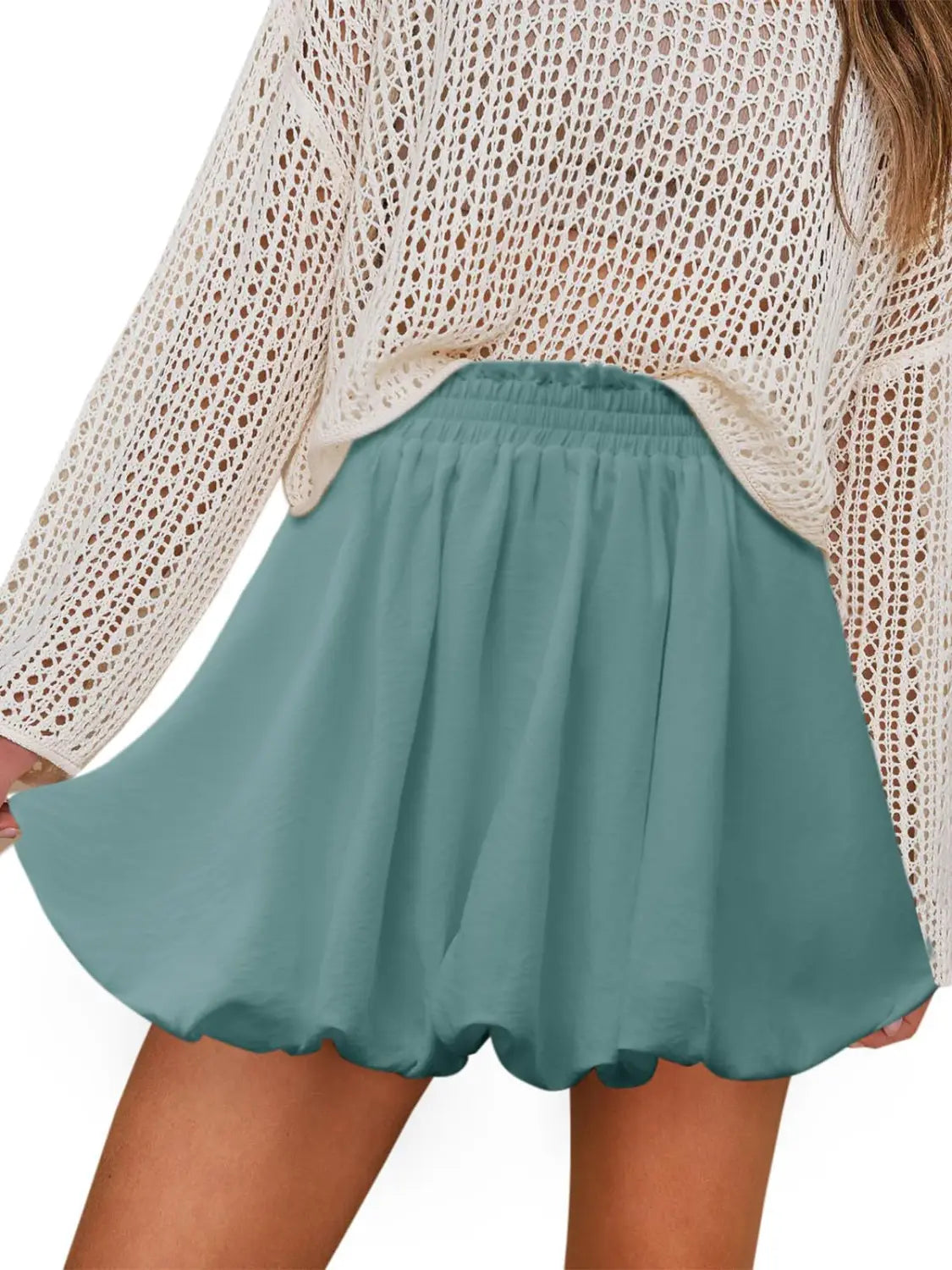 a white casual graceful ruffled mini skirt in flowing teal pleated fabric with a gathered waistband