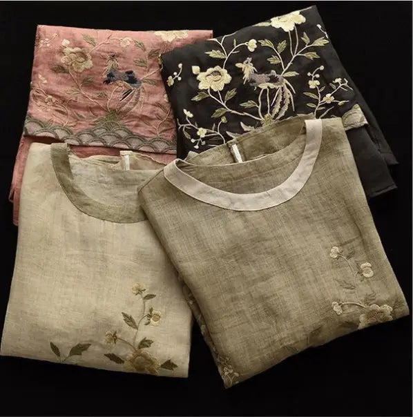 Beige linen top with art retro embroidery and a contrasting colored round neck featuring a delicate floral design.