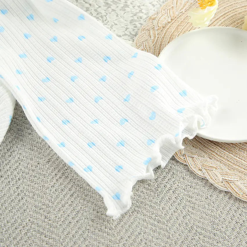 white ribbed fabric sleeve with light blue polka dots and frayed edge from knitted heart printing ribbed loungewear set featuring heart printing comfortable design