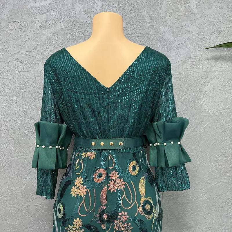 emerald green sequined half sleeve slim floral evening dress with round neck and ruffled bell sleeves featuring pearl accents and floral embroidery