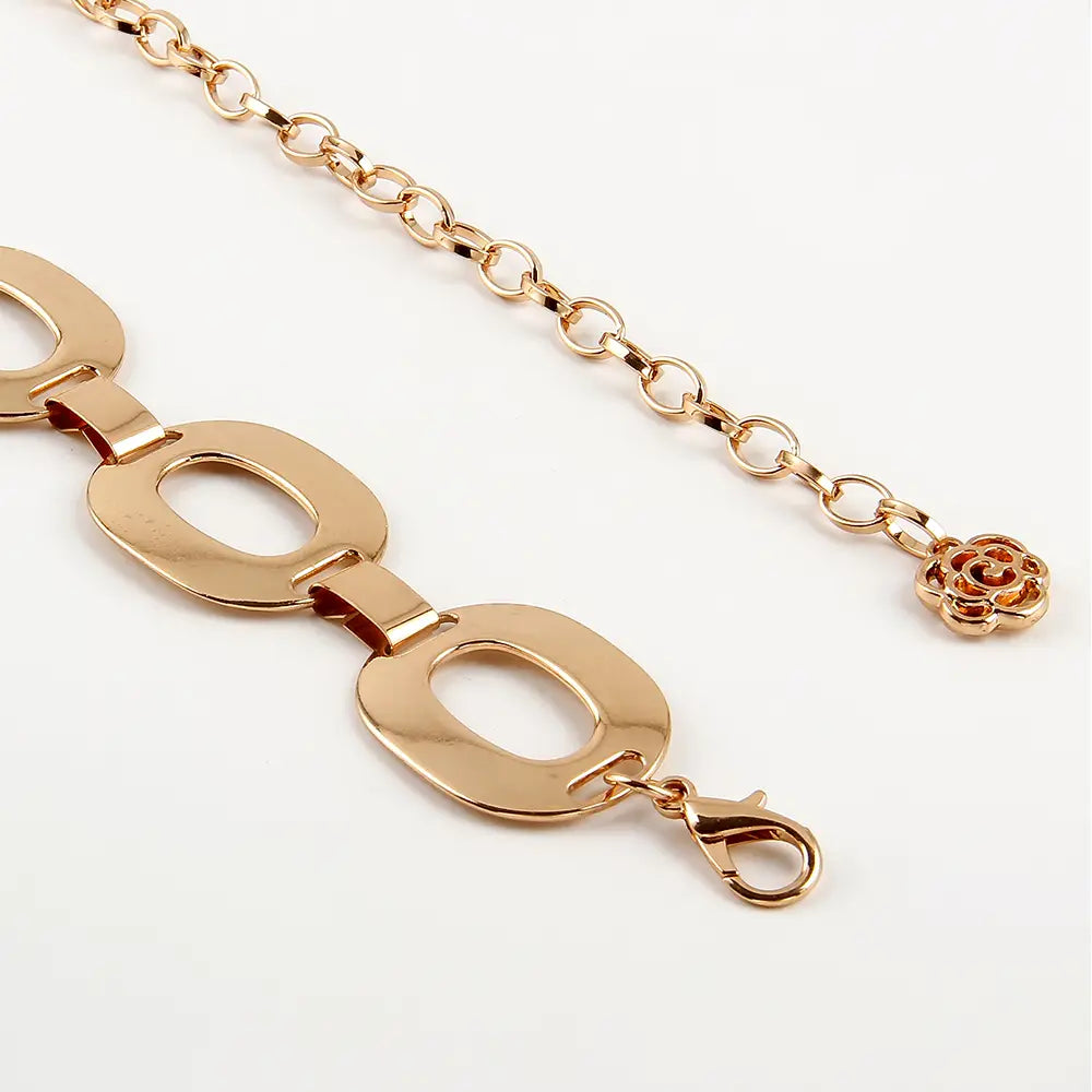 gold-toned jewelry waist chain featuring oval links and a rose charm as summer jewelry waist accessory