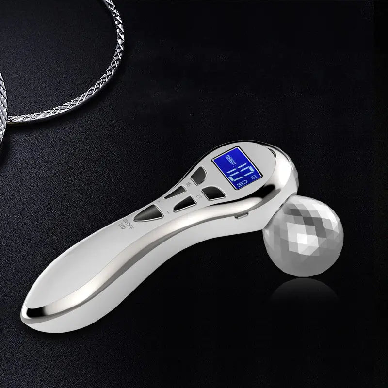 Silver-toned 3-head digital firming beauty massager with a faceted crystal ball head and digital display for effective firming beauty treatments.