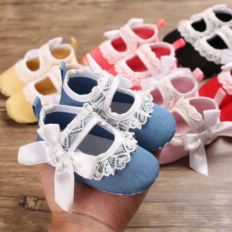 Blue denim princess shoes baby with white lace and bow detail trimmed for baby toddler shoes.