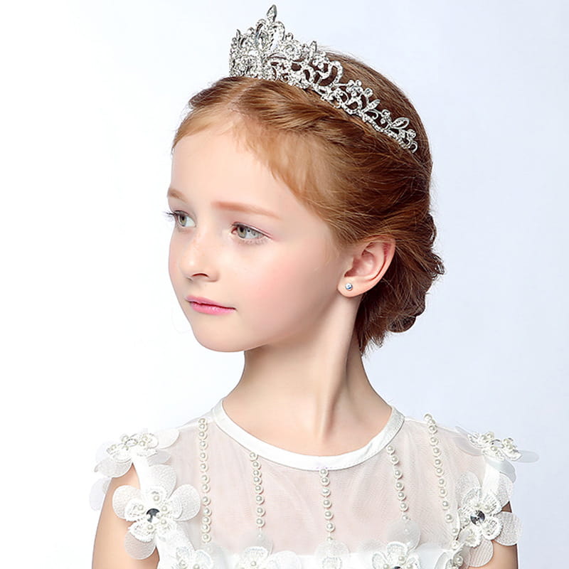 A delicate silver crystal stage flower girl head tiara adorned with sparkling rhinestones and intricate floral designs.