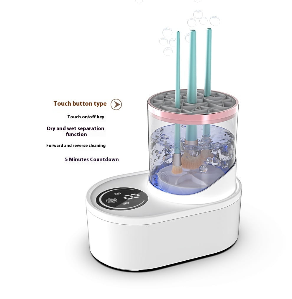 white electric makeup brush cleaner with pink accents featuring a transparent cylindrical tank and digital timer holds three teal brush handles upright in water for effective makeup brush cleaning.