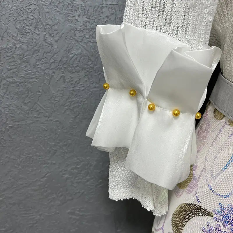 white ruffled sleeve detail with golden beads on a half sleeve slim fit round neck shirt suitable for evening wear