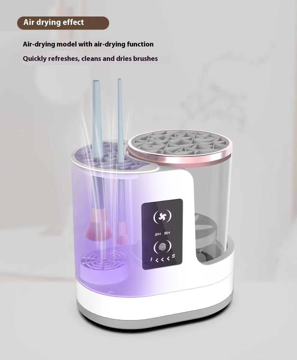 Electric makeup brush cleaner in white and translucent plastic with a rose gold rim featuring a digital timer and air-drying function for quickly refreshing and drying makeup brushes.