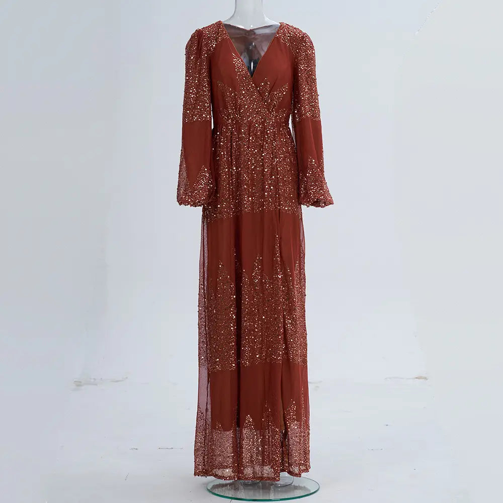 a rust bell sleeve sexy long sequined maxi dress with a v neckline and shimmering sequins on the bodice and skirt perfect for an elegant evening occasion