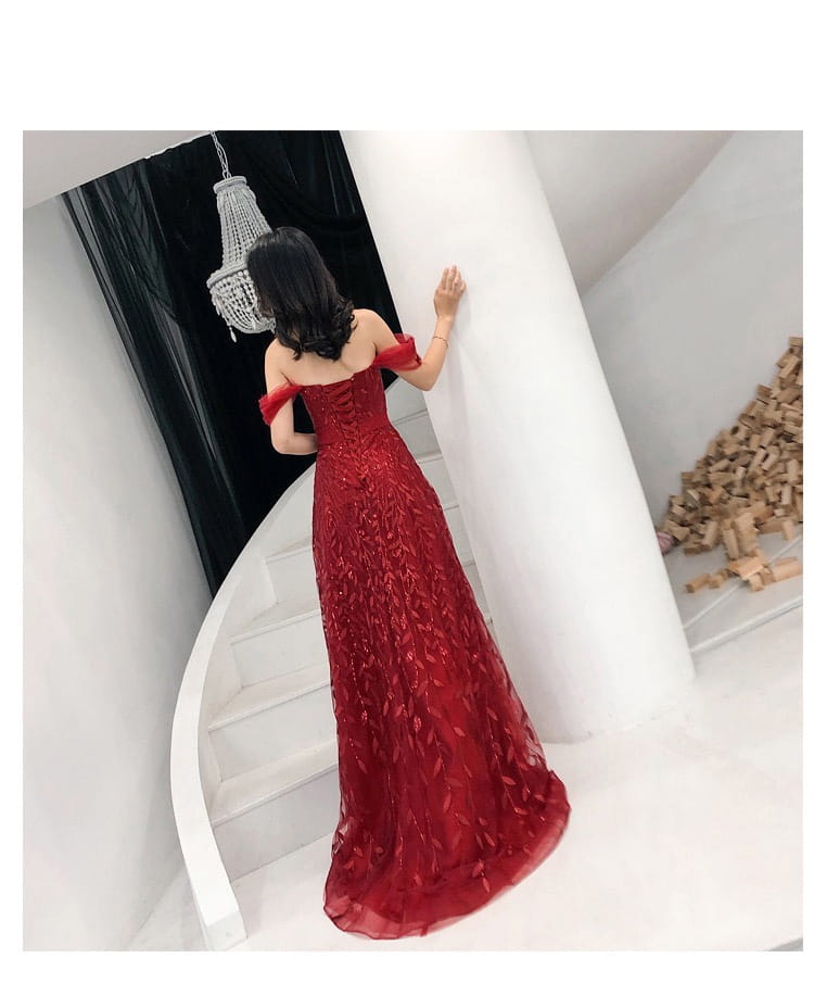 a shimmering red off-the-shoulder evening dress with intricate lace slim slimming detailing and a flowing silhouette perfect as a slim slimming bridal gown
