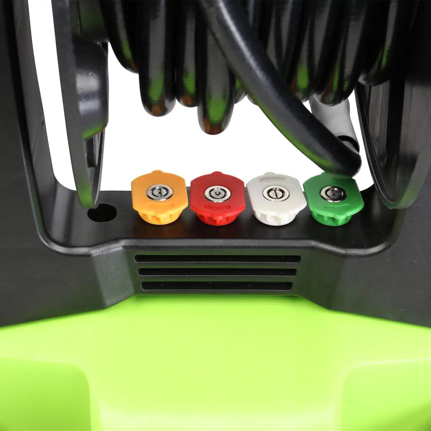 Four colorful nozzle caps in yellow red white and green are mounted on a black plastic base beneath coiled hoses of a green and black high pressure cleaner.