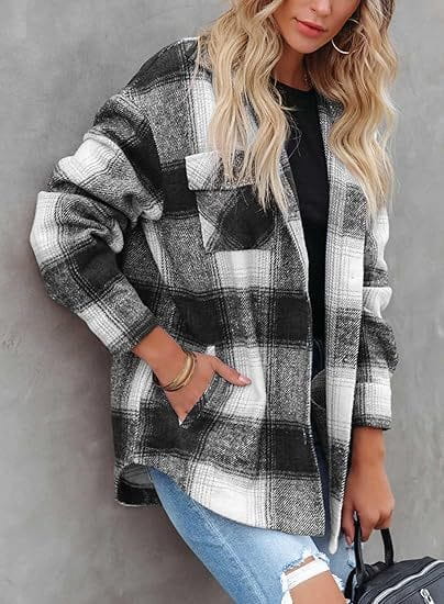 Women’s plaid buckle long sleeve jacket in black and white plaid flannel with a relaxed fit.
