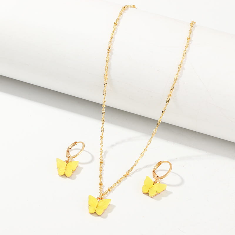 Gold chain necklace with a yellow resin butterfly pendant and matching gold hoop earrings featuring fashion resin butterfly accents in a creative fashion resin butterfly necklace and earring set.