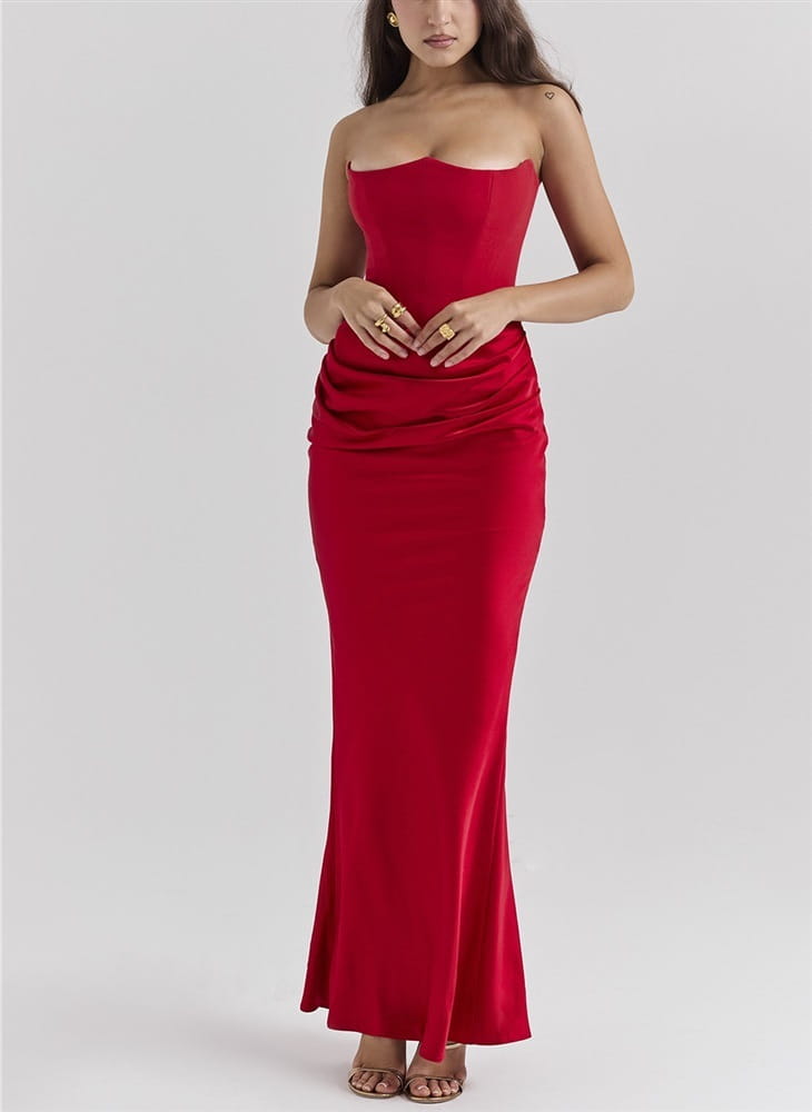 A vibrant red satin long dress sexy fashion bandeau style with a strapless fitted bodice and flowing mermaid skirt.