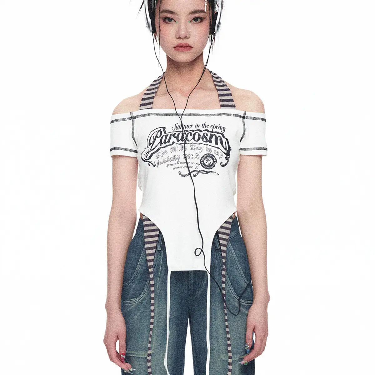 White off-the-shoulder crop top with black striped trim and paracosmo graphic print from spicy girls summer millennium collection, showcasing luxury women’s fashion.