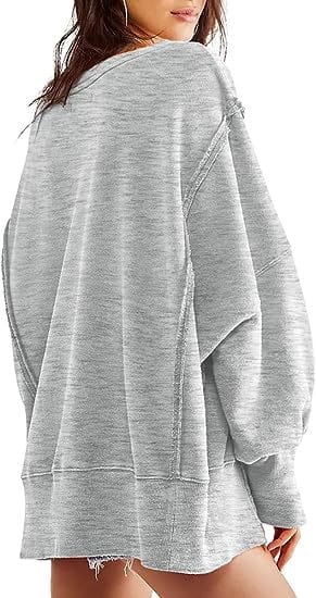 a heather gray solid oversized sweatshirt crew with a relaxed fit, frayed hem, and side zippers designed for casual comfort
