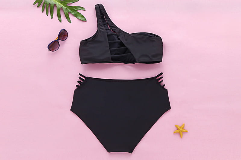 Black one shoulder high waist plus size swimsuit featuring side slits and a high waisted bottom for enhanced waist plus size fit.