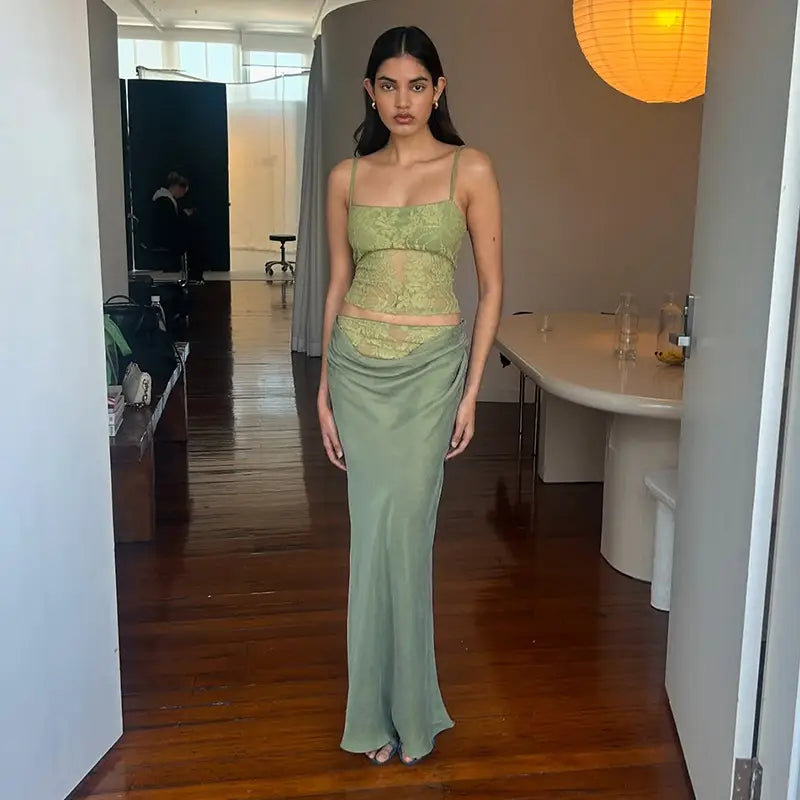 A sage green two-piece set featuring a lace backless tube bodice with sling stitching ruffle and a flowing satin stitching ruffle hip skirt.