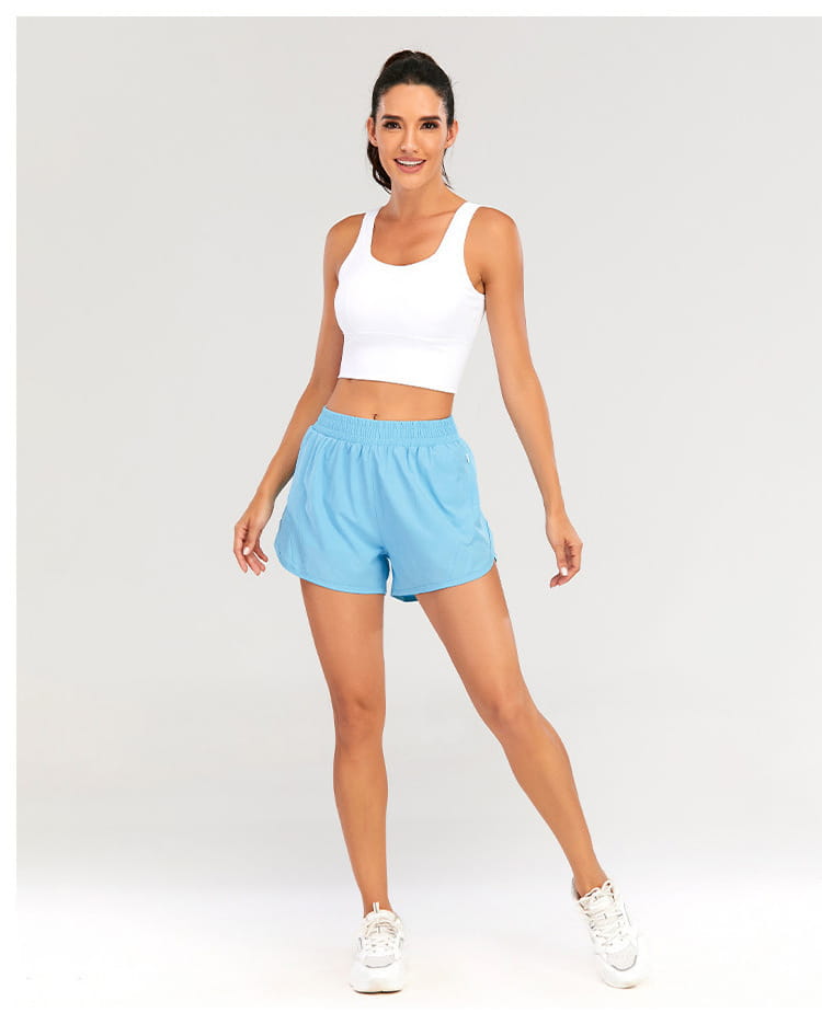 light blue summer sports shorts with an elastic waistband, relaxed fit, and breathable zipper pockets designed for comfort and convenience.
