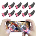 Black and pink gaming finger sleeves with pink silver thread and fluorescent powder shown in use for gaming precision on smartphone