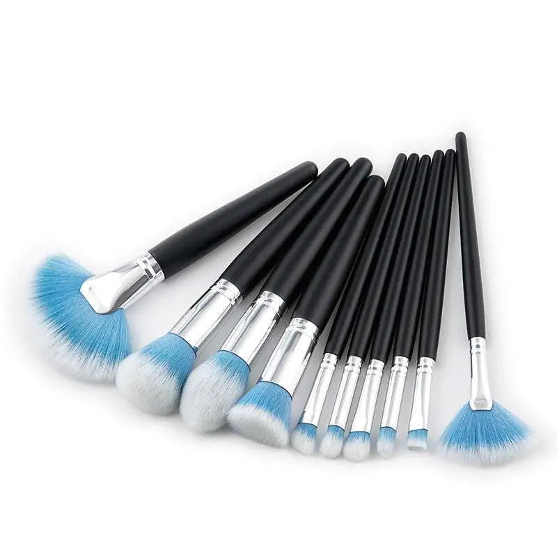 Set of ten professional makeup brushes with black handles, silver ferrules, and purple gradient synthetic bristles