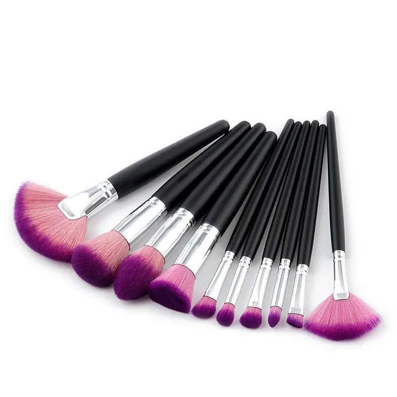 Set of ten professional makeup brushes with black handles, silver ferrules, and purple gradient makeup bristles